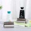 s-l140-935.webp 1PC Rolling Toothpaste Tube Squeezer Stainless Steel Dispenser Squeeze Holder UK