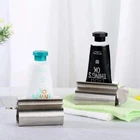 s-l140-935.webp 1PC Rolling Toothpaste Tube Squeezer Stainless Steel Dispenser Squeeze Holder UK